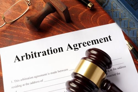 an arbitration agreement form on a desk