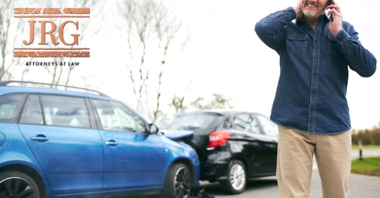 driver on the phone after a car accident