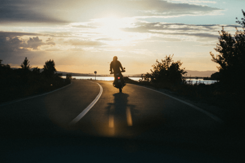 motorcyclist riding on highway in monterey